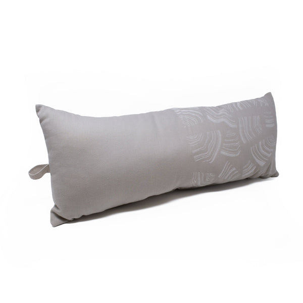 Beige long pillow on white background