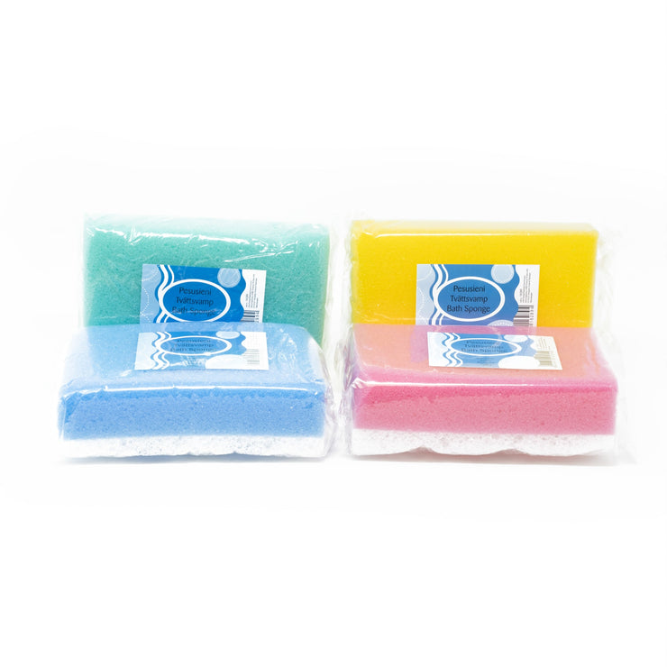 View of Green, yellow, blue and red, exfoliating shower sponges arranged on a white background.