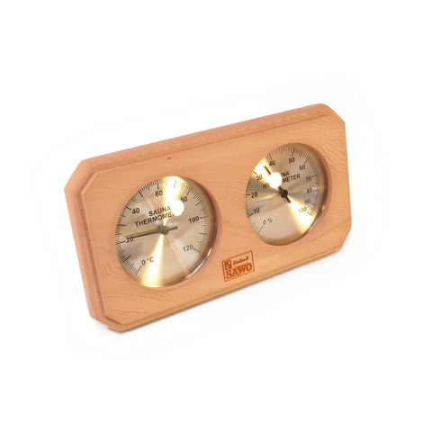 Angle shot of thermometer and hydrometer enclosed in a cedar frame on white background.
